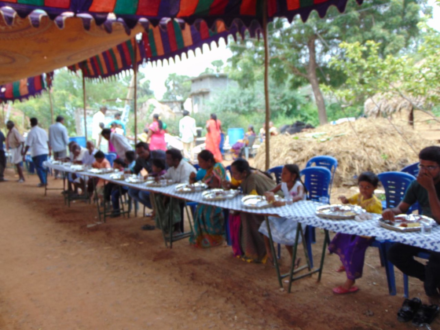 People eating a free community meal