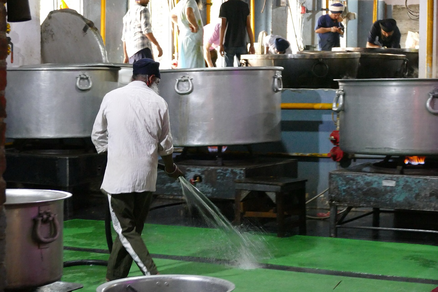 A volunteer cleaning the floor